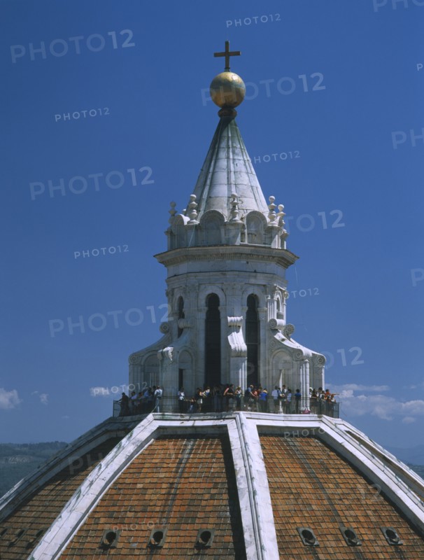 ITALY, Tuscany, Florence, The Duomo.  Apex of the Dome by Brunelleschi with tourists encircling spire.  Taken from the Campanile.