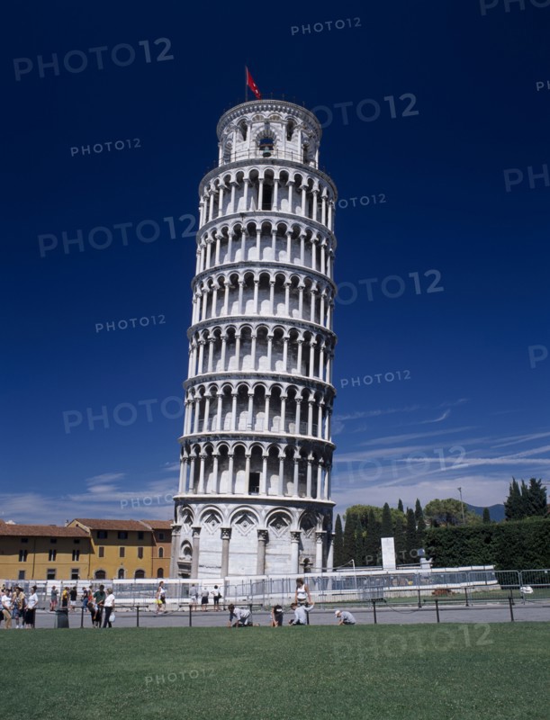 ITALY, Tuscany, Pisa, The Leaning Tower with barriers around base while restoration work is carried out and visitors in surrounding area.