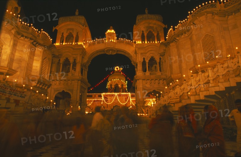 INDIA, Utter Pradesh, Vrindaven, "Dirwali festival, crowds of worshippers outside temple illuminated at night."