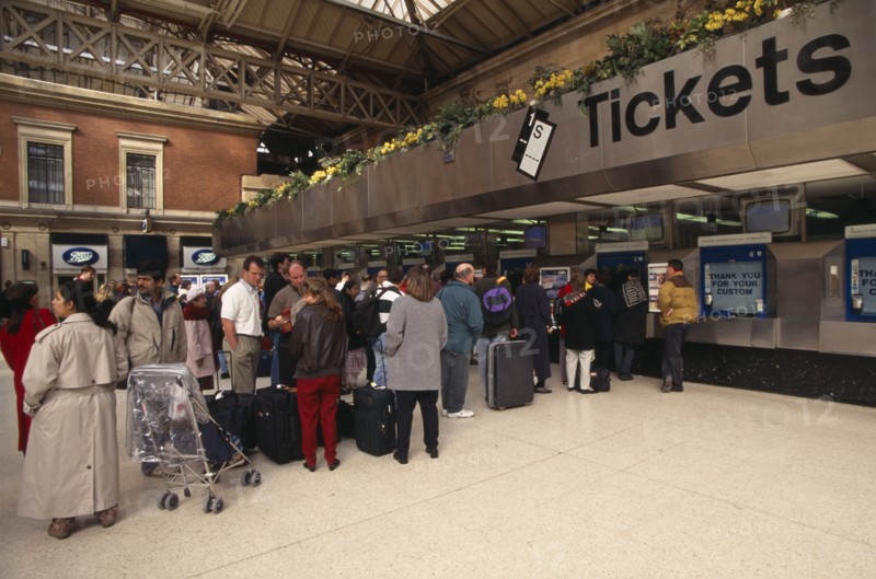 TRANSPORT, Rail, Stations, Passengers queue for tickets at London Victoria
