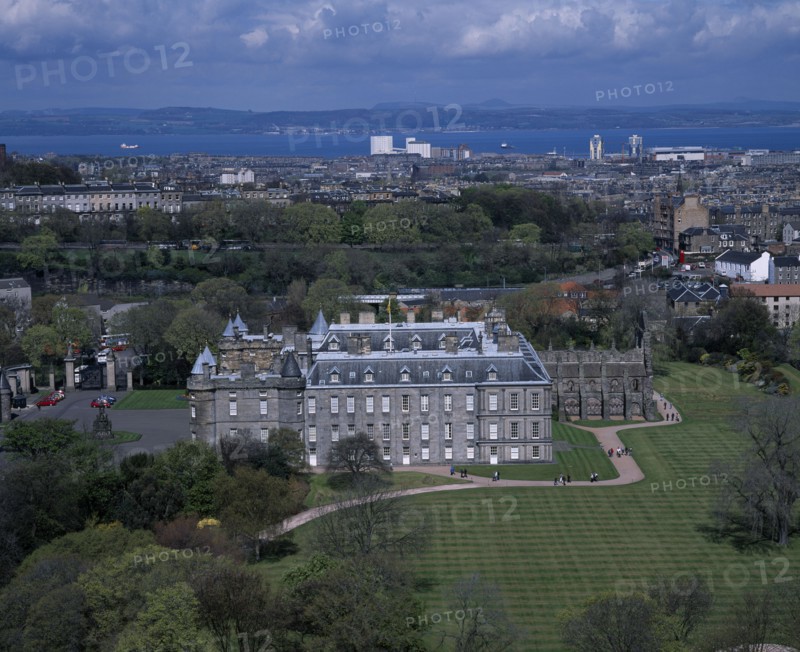 SCOTLAND, Lothian, Edinburgh, "Holyrood Palace, the Queens official Scottish residence.  Exterior view from Salisbury Craggs with city behind."