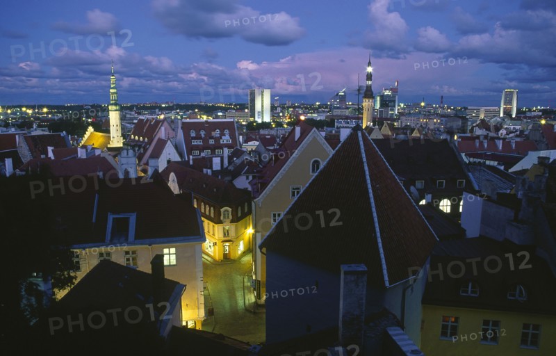 ESTONIA, Tallinn, View across Old Town rooftops at night.