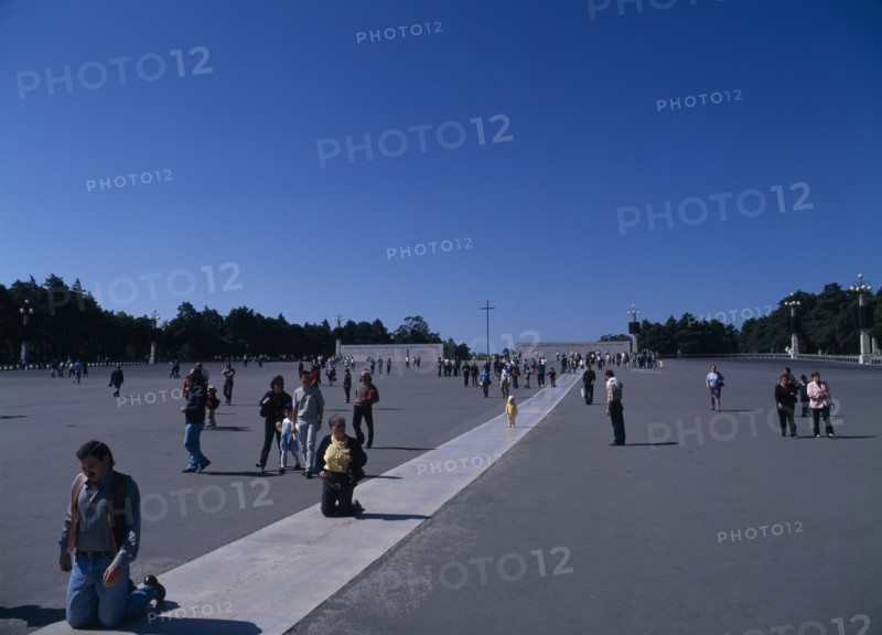 PORTUGAL, Biera Litoral, Fatima, Pilgrims on knees making thier way toward the church & shrine