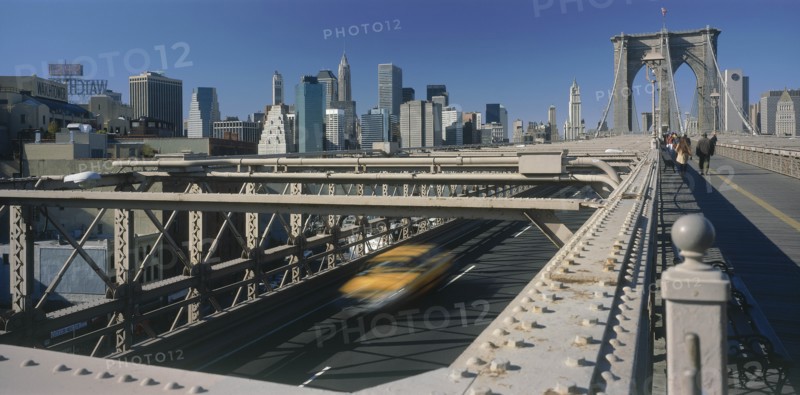 USA, New York State, New York, Lower Manhattan.  Post September 11 skyline from Brooklyn Bridge with traffic and pedestrians crossing.
