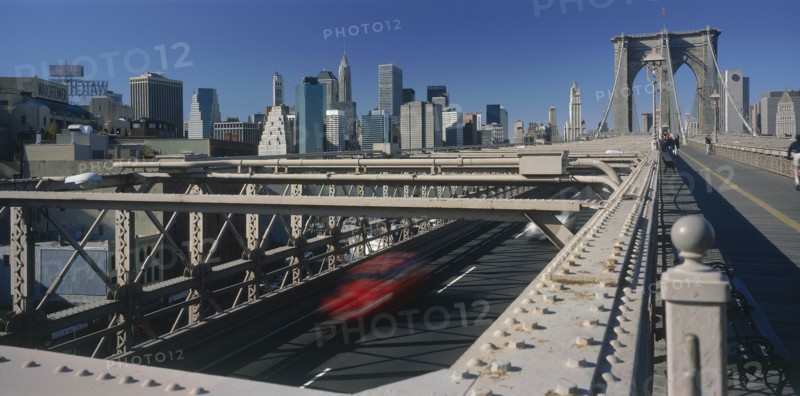 USA, New York State, New York, Lower Manhattan.  Post September 11 skyline from Brooklyn Bridge with traffic and pedestrians crossing.