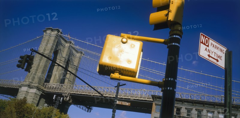 USA, New York State, New York, Part view of Brooklyn Bridge with road sign and traffic lights in the foreground.