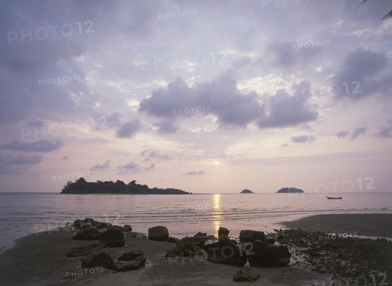 THAILAND, Trat Province, Koh Chang, "Kai Bae Beach view of sunset over Koh Man Nai, Koh Man Nok and Koh Pli Islands."