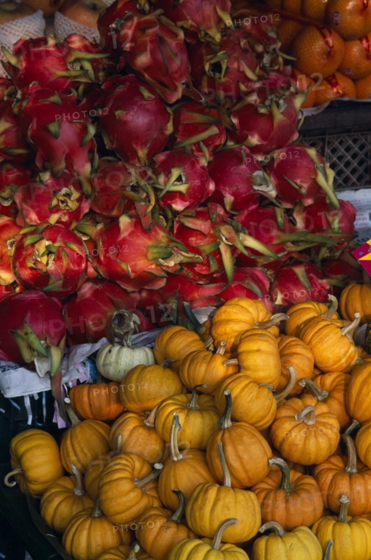 THAILAND, North, Chiang Mai, Wholesale Food Market.  Squash and Dragon fruit displayed on market stall.