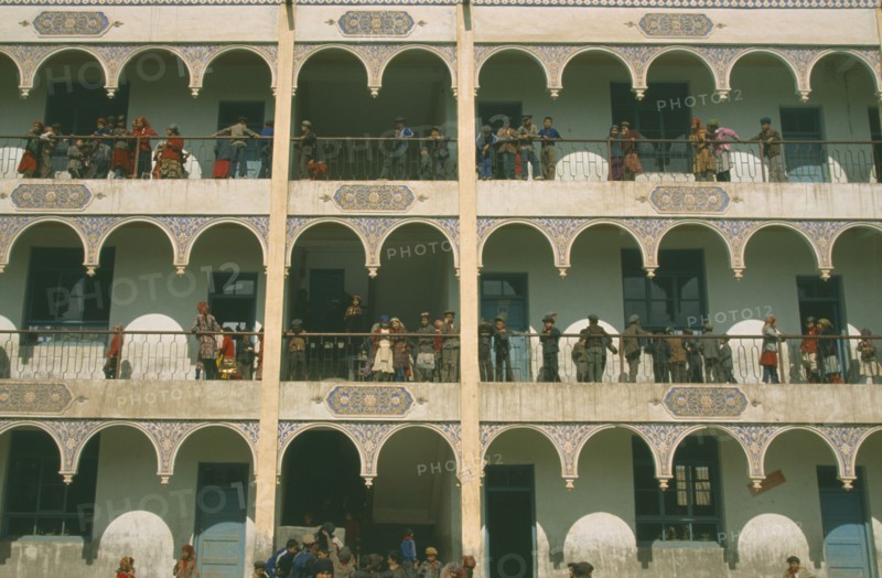 CHINA, Xinjiang Province, Kashgar, Uygur schoolchildren on balconies of multi-storey building.