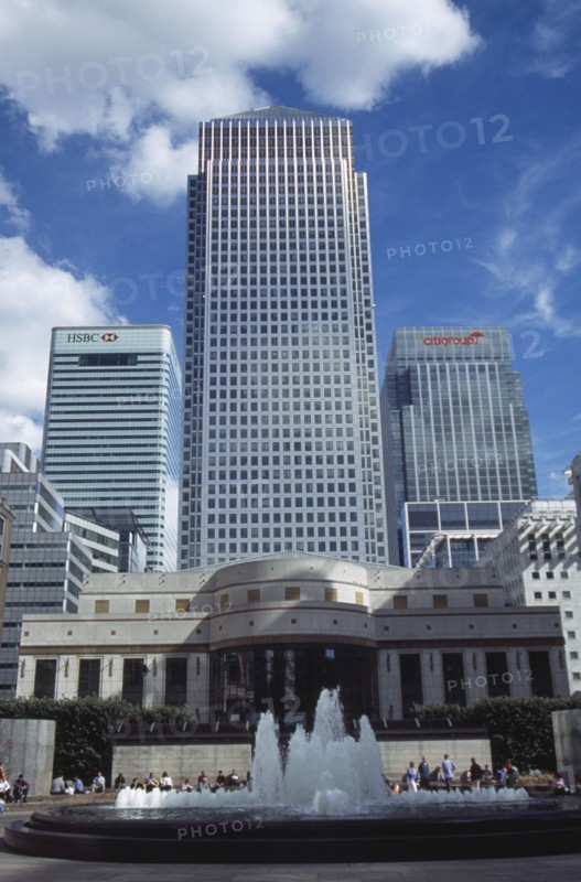 ENGLAND, London, "Canary Wharf, view looking up at the tower and surrounding architecture with fountain in the foreground"