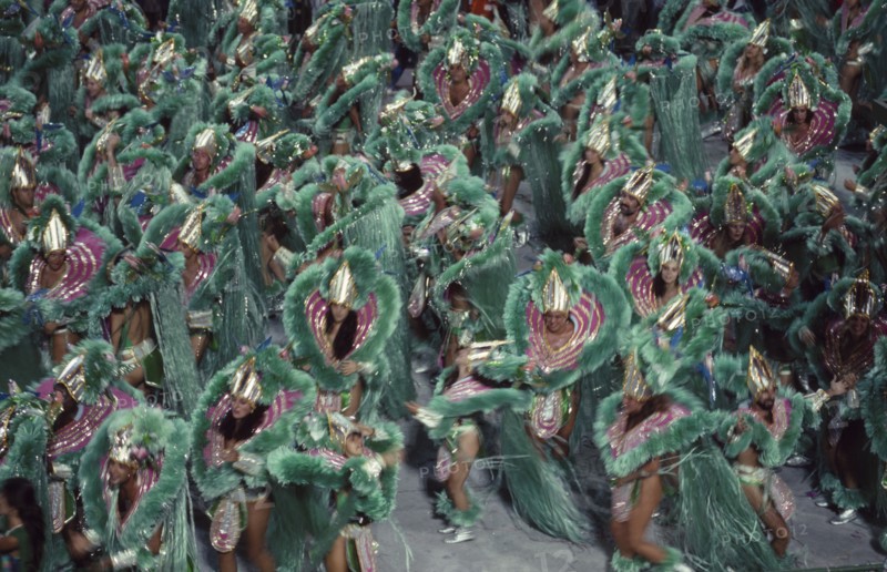 BRAZIL, Rio de Janeiro, Carnival procession of dancers dressed in green feathered costumes