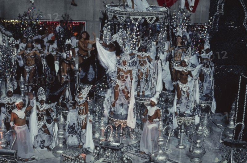 BRAZIL, Rio de Janeiro, Carnival float carrying dancers wearing white beaded costumes