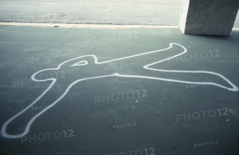USA, Florida, Painted outline of murder victim on sidewalk pavement