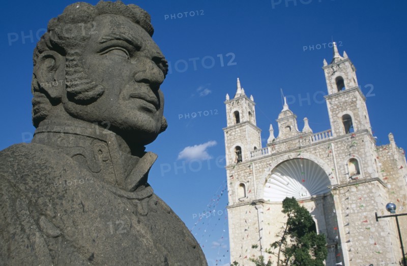 MEXICO, Yucatan, Mérida, Angled view of the Church of San Cristobal facade with head of statue of Don Ignacio de Allende in the foreground.