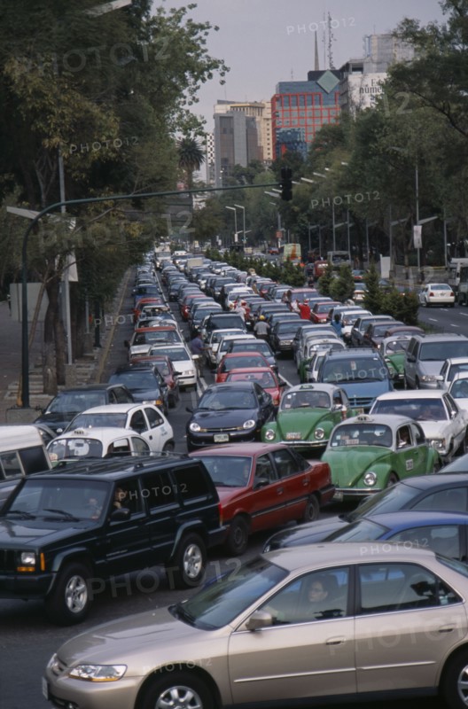 MEXICO, Mexico City, "Traffic congestion on Paseo de La Reforma, long tailback of cars and taxis."