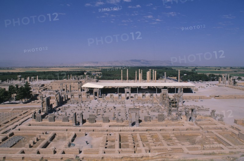 IRAN, South, Persepolis, Fifth century BC Archaemenid palace complex.  View over ruins from the tomb of Axerxes II.  The name Persepolis is Greek meaning City of the Persians.