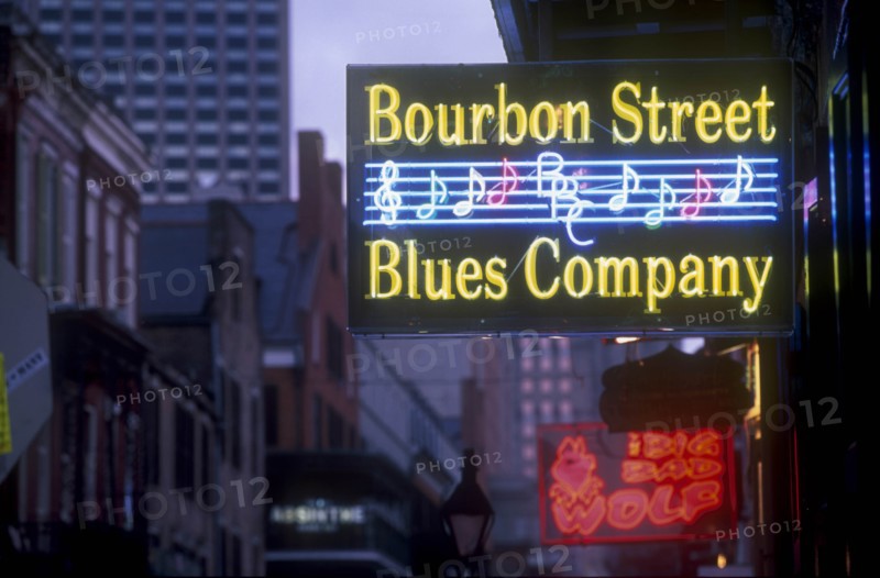 USA, Louisiana, New Orleans, Bourbon Street.  Illuminated neon street signs.