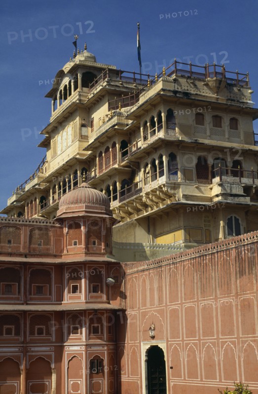 INDIA, Rajasthan, Jaipur, City Palace / Royal Palace looming over pink and white building