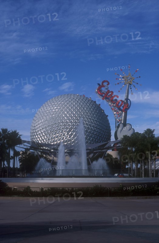 USA, Florida, Orlando, Walt Disney World Epcot. View of the Spaceship Earth with sparkling red Epcot sign and fountain at the base.