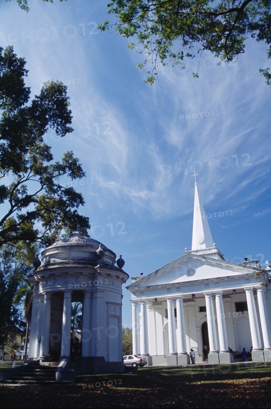 MALAYSIA, Penang, Georgetown, St. Georges Church.  Anglican church built in 1817 using convict labour.  Classical style exterior with free standing open sided turret in foreground.