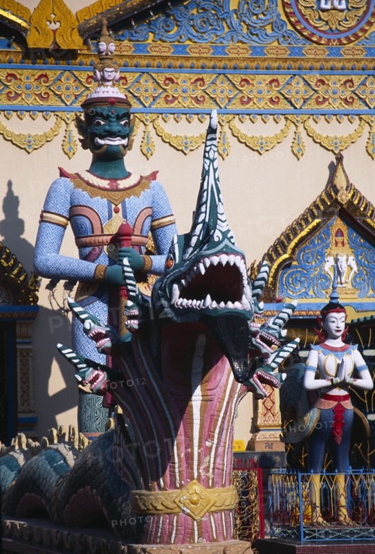 MALAYSIA, Penang, Georgetown, Wat Chayamangkalaram.  Temple guardsman and dragon statues.