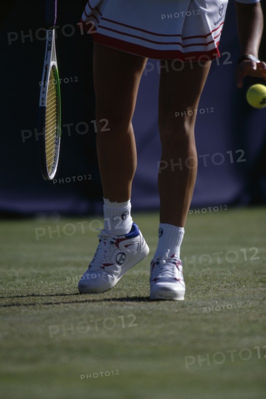 10128797 SPORT   Tennis  Gabriel Sabatini competing at Wimbledon. View of lower body preparing to serve