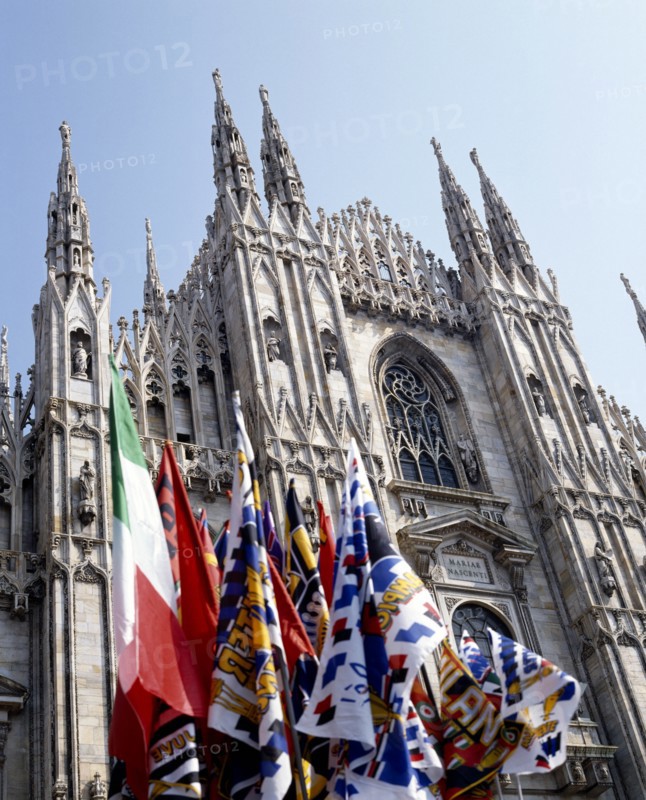 ITALY, Lombardy, Milan, Cathedral frontage with a souvenir stall selling flags and scarves