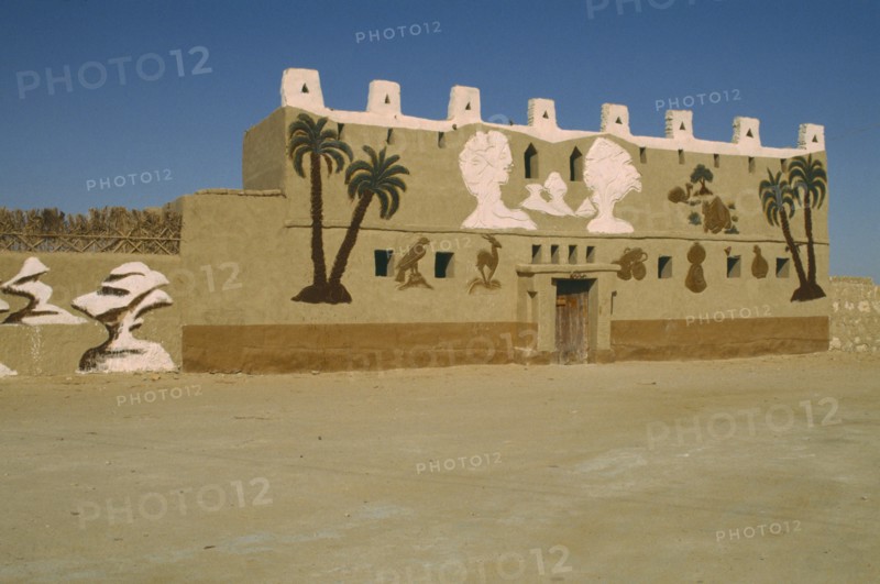 EGYPT, Western Desert, Farafra Oasis, General view of museum building. Mural on facade painted by Badr