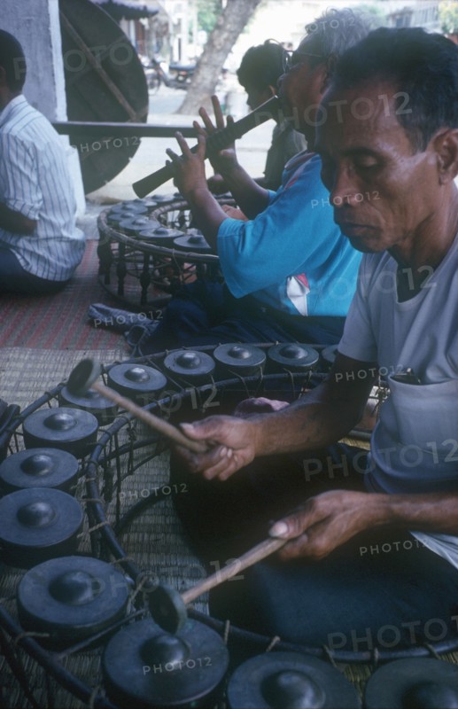 CAMBODIA, Phnom Pehn, Group of musicians playing traditional instruments.
