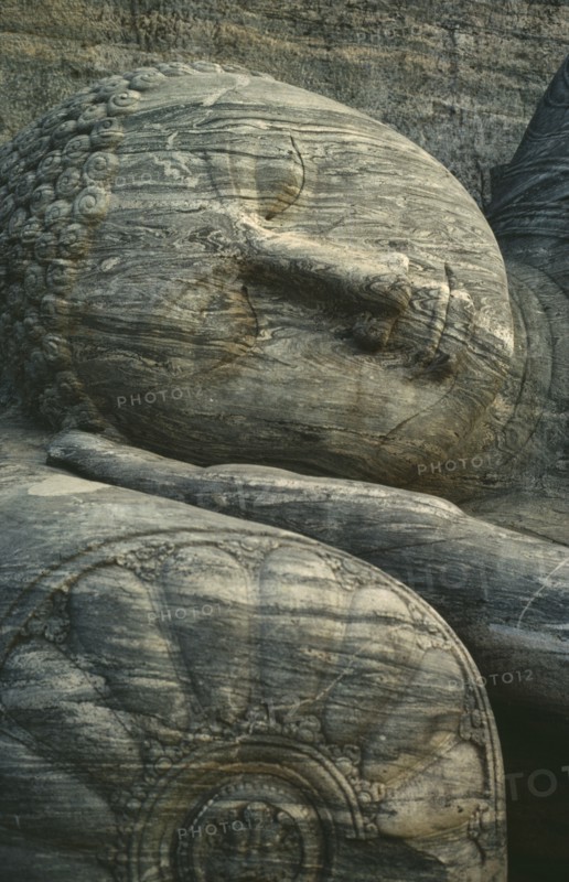 SRI LANKA, Polonnaruwa, Stone carved reclining Buddha detail of head lying on hand