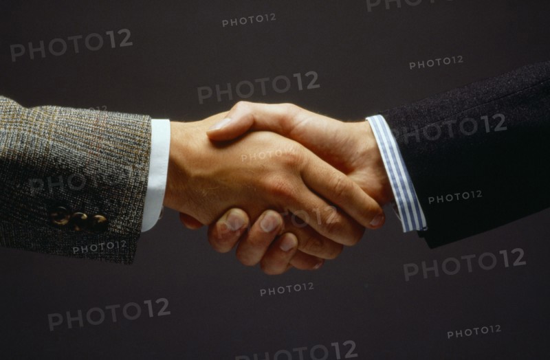 BUSINESS, Handshake, Close up of two men shaking hands as a greeting