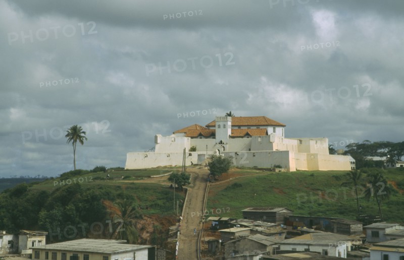 GHANA, Fort St Jago Elmina, White hill fort with path leading up to the entrance.