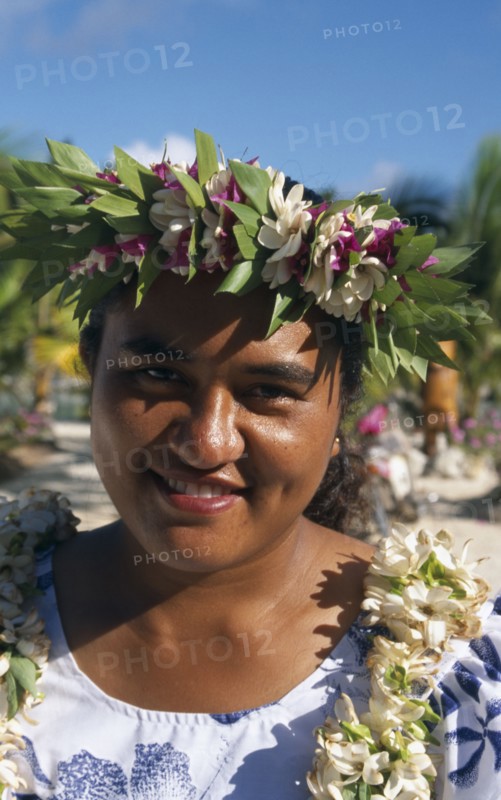 PACIFIC ISLANDS, Cook Islands, Aitutaki, Portrait of a woman wearing a garland