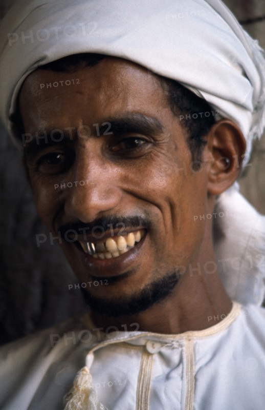OMAN, People, Men, Portrait of man wearing white turban smiling