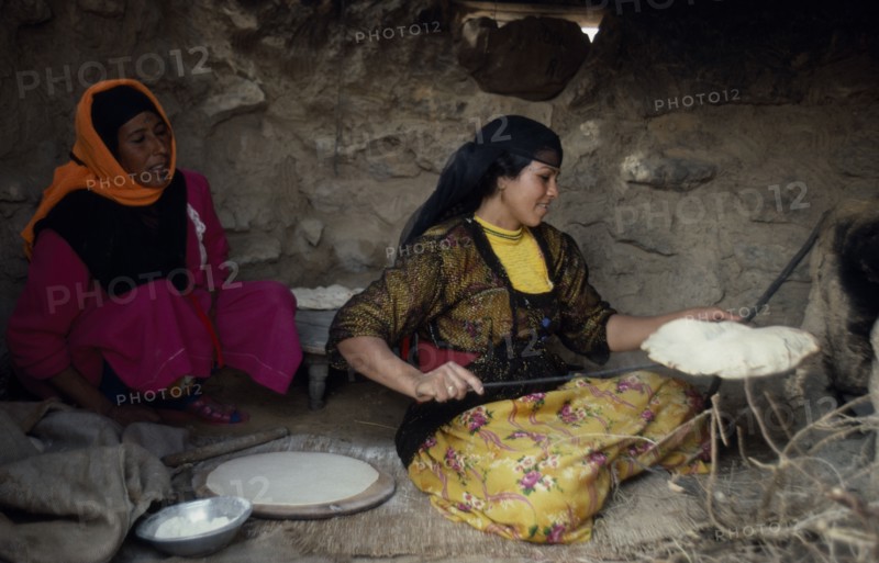 EGYPT, Western Desert, Settled Bedouin women making bread