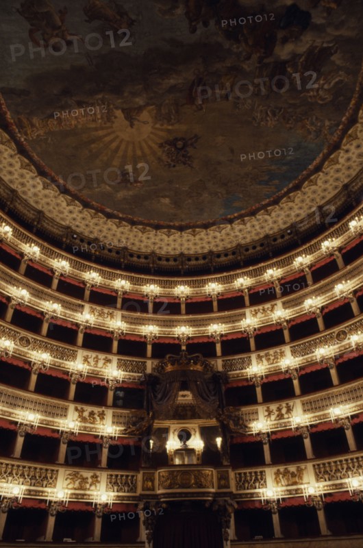 ITALY, Campania, Naples, Teatro San Carlo opera house interior with painted ceiling and ornate balcony boxes.
