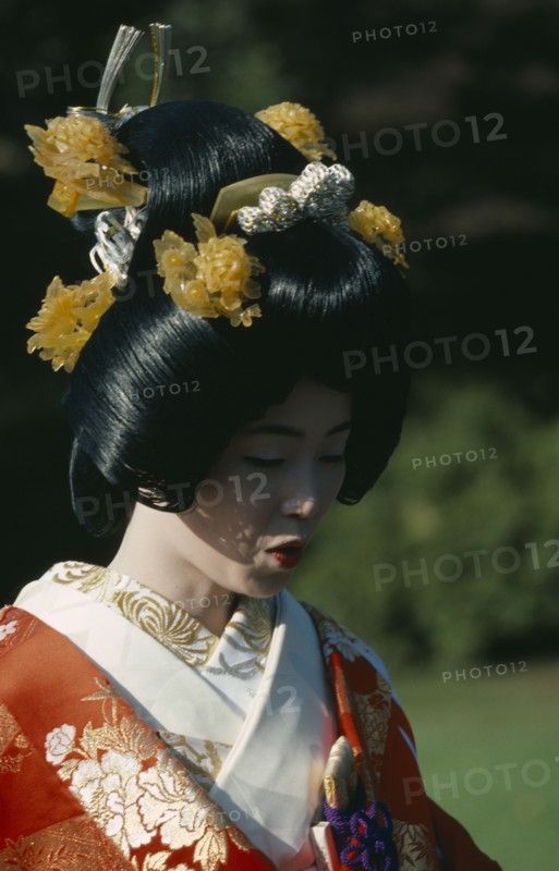 JAPAN, Honshu, Tokyo, Shinto wedding with bride in traditional dress and elaborate hairstyle