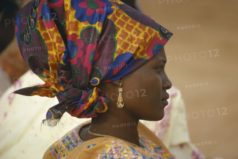 NIGERIA, Traditional Dress, Hausa woman in traditional head dress.  Head and shoulders portrait profile right.