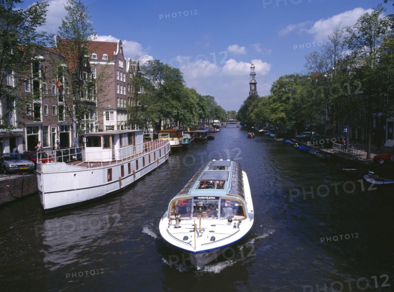 HOLLAND, Noord, Amsterdam, Glass top tourist boat travelling down the Prinsengracht canal