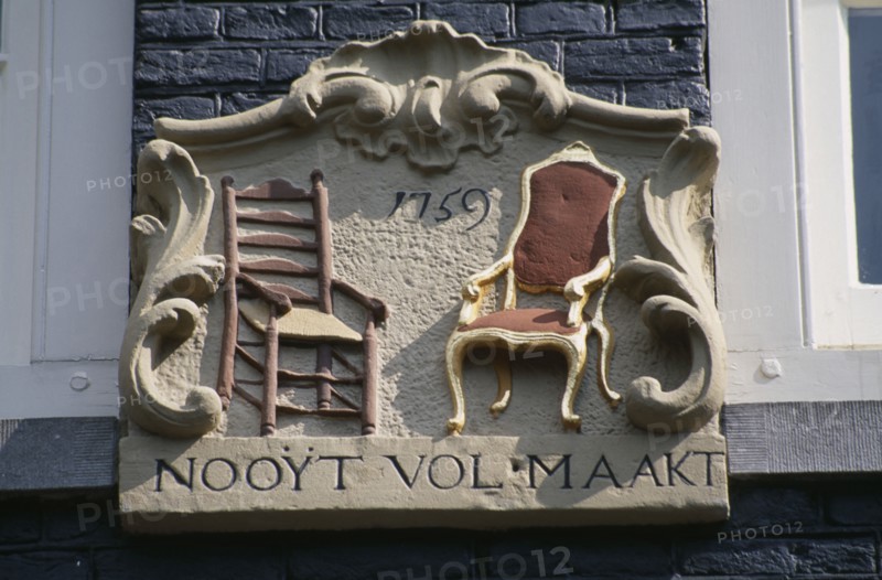 HOLLAND, Noord, Amsterdam, Close up detail of a wall tablet used before house numbers were added