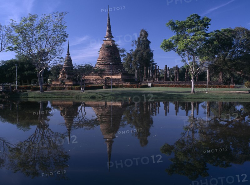 THAILAND, North, Sukhothai Province, Sukhothai Historical Park. Wat Sra Sri on island with reflections on water