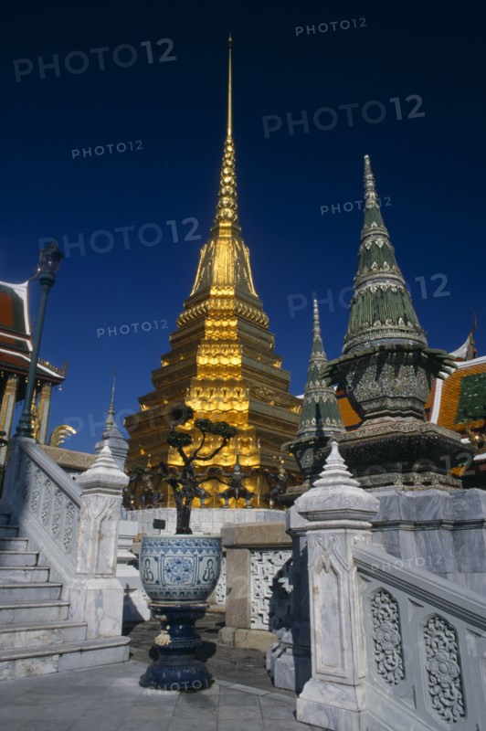 THAILAND, Bangkok, Grand Palace. Pillars and steps surrounding the building at The Royal Pantheon