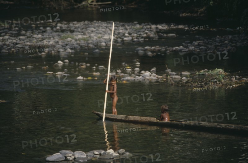 PANAMA, Children, Embera Indian children on wooden canoe.