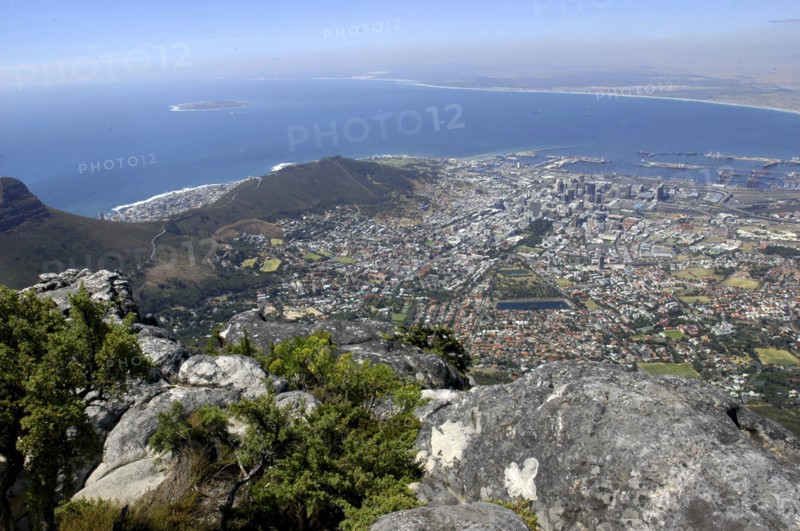 SOUTH AFRICA, Western Cape, Cape Town, Aerial view from mountain top over city below and coastline beyond