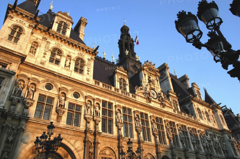 FRANCE, Ile de France, Paris, Angled view looking up at the facade of the Hotel de Ville seen in evening light