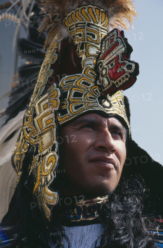 MEXICO, Mexico City, Our Lady of Guadaloupe Festival male Indian dancer outside the Basilica