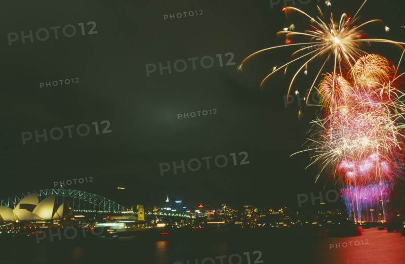 AUSTRALIA, New South Wales, Sydney, New Years fireworks display over Sydney Harbour with the Opera House and Harbour Bridge illuminated
