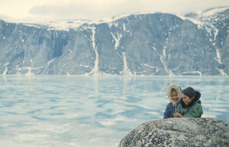 CANADA, Nunavut, Baffin Island, Inuit children in glacial landscape.