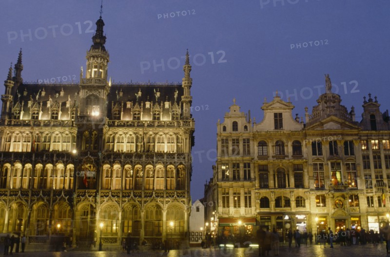 BELGIUM, Brabant, Brussels, The Grand Place illuminated at night busy with people.
