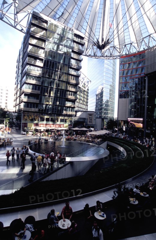GERMANY, Berlin, Potsdamer Platz. Sony complex interior with crowds gathered around central water fountain